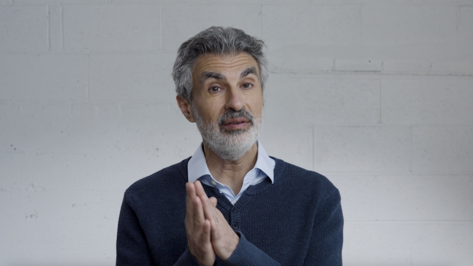 Yoshua Bengio speaking to the camera. 