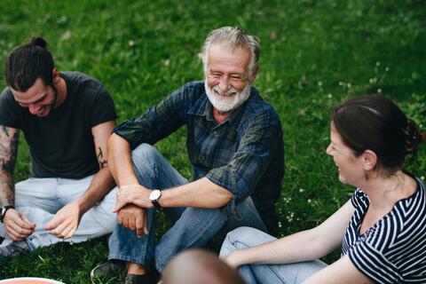 Happy friends chatting in the park.